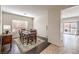 Dining room area with dark wood laminate flooring and large window at 2653 Rimbaud St, Henderson, NV 89044