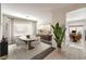 Bright dining room with modern table, chairs, and a large window with plenty of natural light at 2653 Rimbaud St, Henderson, NV 89044