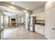 Open kitchen and living area featuring tile flooring, modern appliances, and seamless flow for entertaining at 2653 Rimbaud St, Henderson, NV 89044