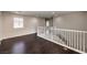 Bright landing area with white banister and hardwood floors at 2653 Rimbaud St, Henderson, NV 89044