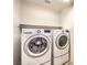 Laundry room with side-by-side washer and dryer and a storage shelf at 2653 Rimbaud St, Henderson, NV 89044