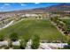 Expansive green lawn or sports field within a community, ideal for recreation, games, and outdoor activities at 2653 Rimbaud St, Henderson, NV 89044