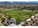 Large green lawn or sports field within a community, perfect for games, events, and outdoor recreation at 2653 Rimbaud St, Henderson, NV 89044