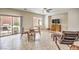 Living room with neutral colored tile, a ceiling fan, and a view of the backyard at 2653 Rimbaud St, Henderson, NV 89044