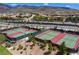 Community tennis courts, ideal for sports and recreation, surrounded by lush landscaping and neighborhood homes at 2653 Rimbaud St, Henderson, NV 89044
