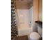 Bathroom featuring a shower, shower curtain, tile walls, and a toilet at 270 E Flamingo Rd # 319, Las Vegas, NV 89169