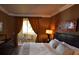 Cozy bedroom with balcony access, featuring modern art and wood floors at 270 E Flamingo Rd # 319, Las Vegas, NV 89169