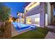 Backyard showcasing a pool, spa, outdoor living space, and well-manicured lawn at 34 Vintage Canyon St, Las Vegas, NV 89141