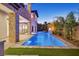 Expansive backyard features a pool, well manicured turf, and lush landscaping for a peaceful retreat at 34 Vintage Canyon St, Las Vegas, NV 89141