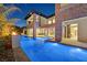 Stunning exterior of a luxury home with a pool, spa and outdoor living area with stone accents at 34 Vintage Canyon St, Las Vegas, NV 89141