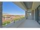 Balcony with stone columns, railing, and panoramic views of the surrounding neighborhood at 34 Vintage Canyon St, Las Vegas, NV 89141