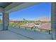 Balcony with railing and expansive views of the luxury neighborhood, mountains, and lush landscape at 34 Vintage Canyon St, Las Vegas, NV 89141