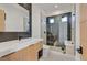 Modern bathroom with a large walk-in shower, contemporary vanity, and a toilet at 34 Vintage Canyon St, Las Vegas, NV 89141