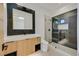 Modern bathroom featuring a glass-enclosed shower, sleek vanity, and contemporary finishes at 34 Vintage Canyon St, Las Vegas, NV 89141