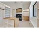 This closet features custom shelves, black washer and dryer, and a window at 34 Vintage Canyon St, Las Vegas, NV 89141