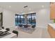 Bright dining area features a dining table, pendant lighting, and large window to the backyard pool at 34 Vintage Canyon St, Las Vegas, NV 89141