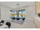 Bright dining space with large windows offers serene views of the pool and lush outdoor area at 34 Vintage Canyon St, Las Vegas, NV 89141