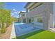 A luxurious home featuring a pool, spa, and a well-manicured lawn at 34 Vintage Canyon St, Las Vegas, NV 89141
