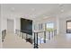 A bright hallway with a glass railing overlooks the main level at 34 Vintage Canyon St, Las Vegas, NV 89141