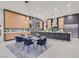Gourmet kitchen boasts modern appliances, a large island with bar seating, and adjacent dining area at 34 Vintage Canyon St, Las Vegas, NV 89141
