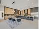 Modern, light-filled kitchen with a large island, sleek countertops, stainless steel appliances, and adjacent dining area at 34 Vintage Canyon St, Las Vegas, NV 89141