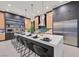 Gourmet kitchen boasts modern appliances, a large island with bar seating, and stylish pendant lights at 34 Vintage Canyon St, Las Vegas, NV 89141