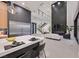 Open concept living room and kitchen featuring stainless steel appliances, an island, and staircase at 34 Vintage Canyon St, Las Vegas, NV 89141