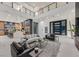 Spacious open-concept living area showcasing a modern kitchen and expansive seating, ideal for entertaining guests at 34 Vintage Canyon St, Las Vegas, NV 89141