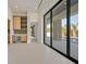 Bright living room with a bar and wine fridge with a view of the pool at 34 Vintage Canyon St, Las Vegas, NV 89141