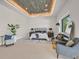 Spacious main bedroom features stylish decor, cozy seating, and a tray ceiling at 34 Vintage Canyon St, Las Vegas, NV 89141