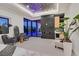 Spacious main bedroom features a fireplace, lounge area, and sliding glass doors with views to the pool at 34 Vintage Canyon St, Las Vegas, NV 89141