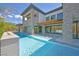 Beautiful pool with a built-in hot tub and elegant stone detailing at 34 Vintage Canyon St, Las Vegas, NV 89141