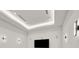 Media room with a tray ceiling, recessed lighting, and wall sconces above the screen at 34 Vintage Canyon St, Las Vegas, NV 89141