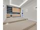 Media room with tiered seating, custom cabinetry, beverage center, and recessed lighting at 34 Vintage Canyon St, Las Vegas, NV 89141