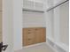 Custom walk-in closet with shelves, hanging rods, drawers, and cabinets at 34 Vintage Canyon St, Las Vegas, NV 89141
