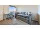 Bedroom featuring a trundle bed, desk, window and neutral carpet at 3574 Desert Cliff St # 204, Las Vegas, NV 89129