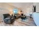 Bright living room with laminate floors, a cozy fireplace, and mountain views at 3574 Desert Cliff St # 204, Las Vegas, NV 89129