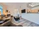 Spacious living room with a fireplace and seamless access to other areas at 3574 Desert Cliff St # 204, Las Vegas, NV 89129
