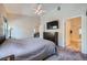 Spacious bedroom with ceiling fan, en suite bathroom and view to dining area at 3574 Desert Cliff St # 204, Las Vegas, NV 89129