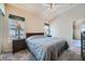 Vaulted ceiling bedroom features ceiling fan, large windows and plush carpet at 3574 Desert Cliff St # 204, Las Vegas, NV 89129