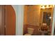 Powder room with a pedestal sink, decorative wallpaper, and updated toilet at 3805 Vidalia Ave, North Las Vegas, NV 89031
