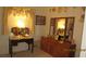 Bedroom vanity, dresser and mirrors with neutral carpet flooring at 3805 Vidalia Ave, North Las Vegas, NV 89031
