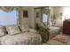 Comfortable bedroom featuring twin beds, floral bedding, and mirrored closet doors at 3805 Vidalia Ave, North Las Vegas, NV 89031