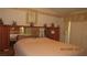 Bedroom featuring a made bed with patterned wallpaper and vintage decor at 3805 Vidalia Ave, North Las Vegas, NV 89031