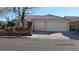 Charming single-story home featuring a terracotta tile roof, two-car garage, and a well-maintained front yard at 3805 Vidalia Ave, North Las Vegas, NV 89031
