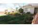 Well manicured front lawn with flower garden at 3805 Vidalia Ave, North Las Vegas, NV 89031
