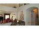 Hallway and doorway with lovely decor, neutral walls, and charming archway at 3805 Vidalia Ave, North Las Vegas, NV 89031