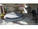 Relaxing backyard hot tub area with covered patio, potted plants, and outdoor seating at 3805 Vidalia Ave, North Las Vegas, NV 89031