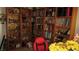 Cozy reading room with floor-to-ceiling bookshelves and a red swivel chair at 3805 Vidalia Ave, North Las Vegas, NV 89031