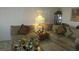 Living room features couches, pillows, and a decorative lamp at 3805 Vidalia Ave, North Las Vegas, NV 89031